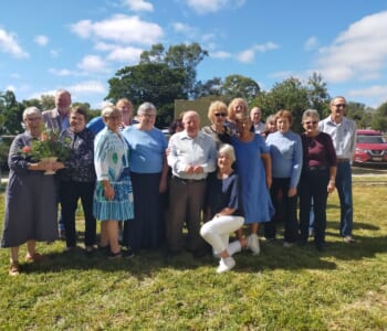 A group of smiling people posing together