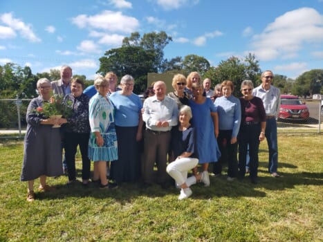 A group of smiling people posing together